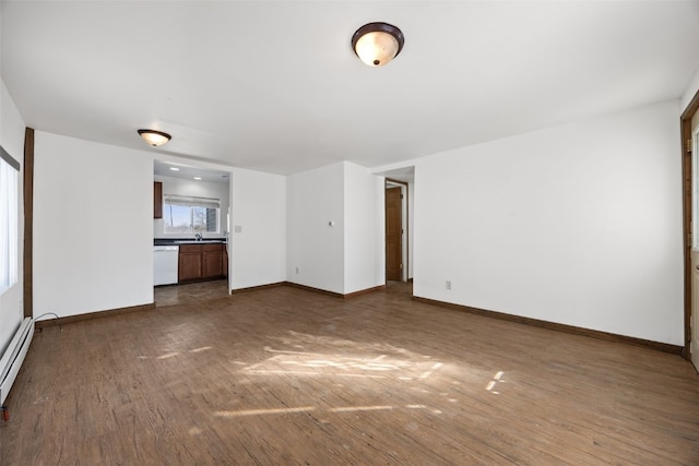 unfurnished living room featuring dark wood-type flooring and sink