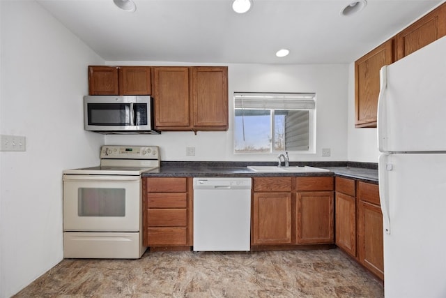 kitchen featuring sink and white appliances