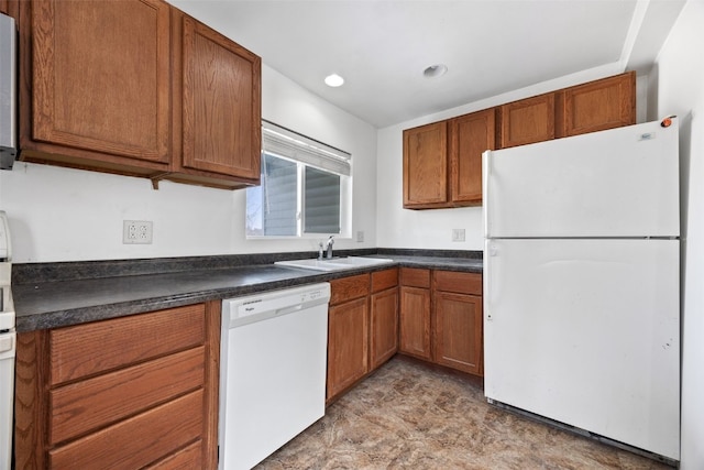 kitchen featuring sink and white appliances