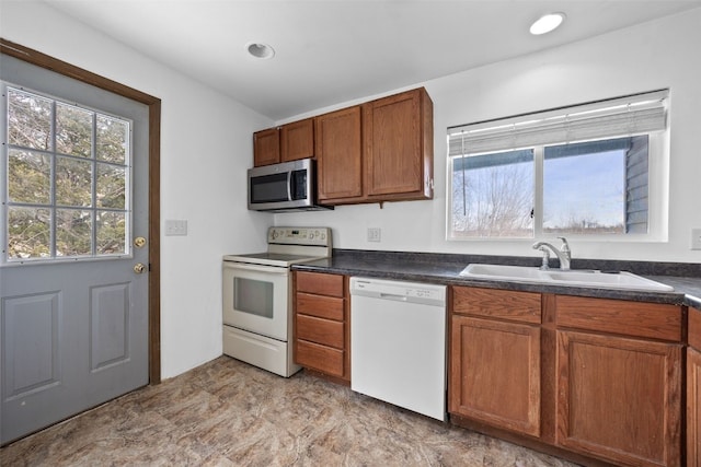 kitchen with white appliances and sink