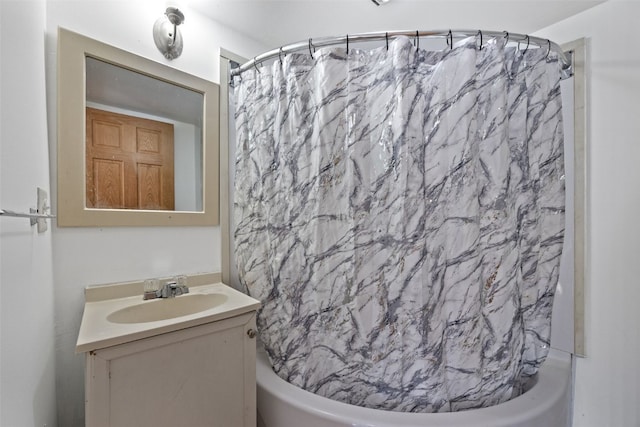 bathroom featuring vanity and shower / bath combo