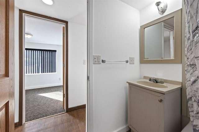 bathroom with vanity and wood-type flooring