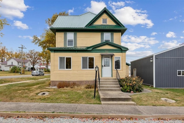 view of front of house with a front lawn