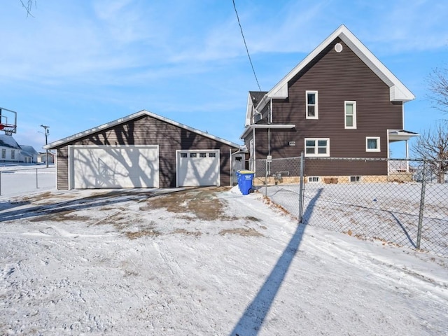 view of property exterior featuring a garage and an outdoor structure