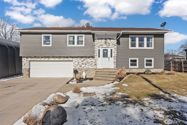 bi-level home featuring a garage