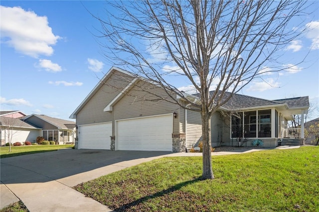 view of front of property with a garage and a front yard