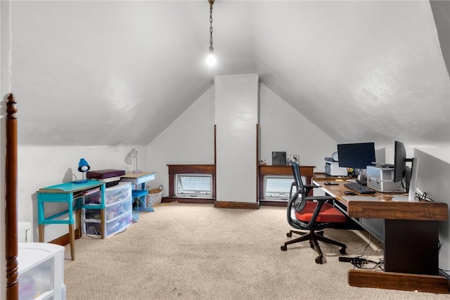 office with lofted ceiling and carpet