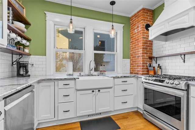 kitchen with stainless steel appliances, white cabinetry, custom exhaust hood, and decorative backsplash