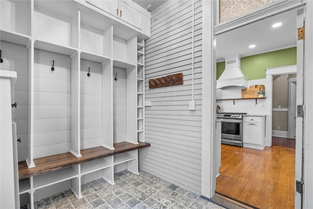 mudroom with light hardwood / wood-style flooring