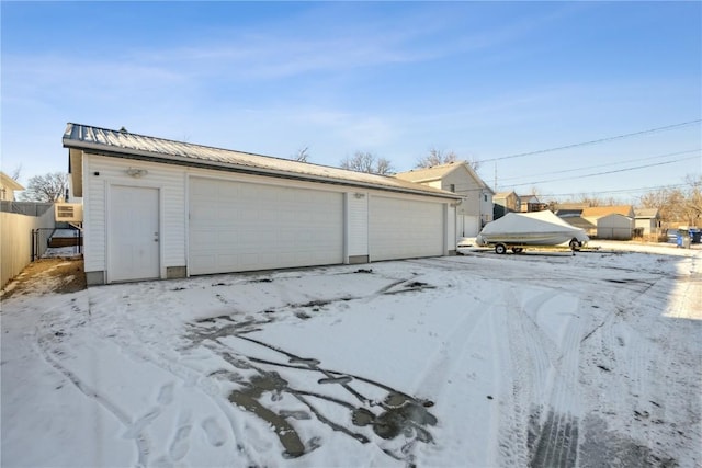 view of snow covered garage