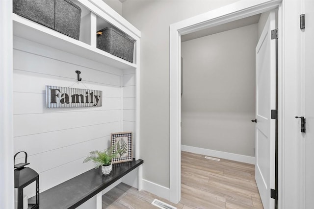 mudroom with hardwood / wood-style floors