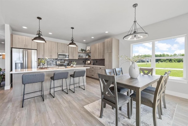 dining space featuring light hardwood / wood-style flooring