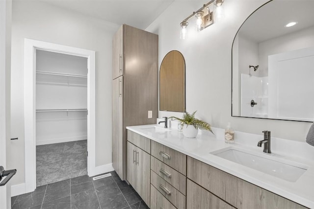 bathroom with vanity and tile patterned floors