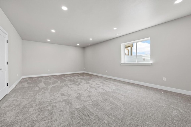 unfurnished room with light carpet