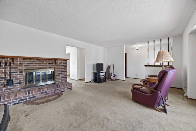 living room featuring a fireplace, light colored carpet, and a textured ceiling