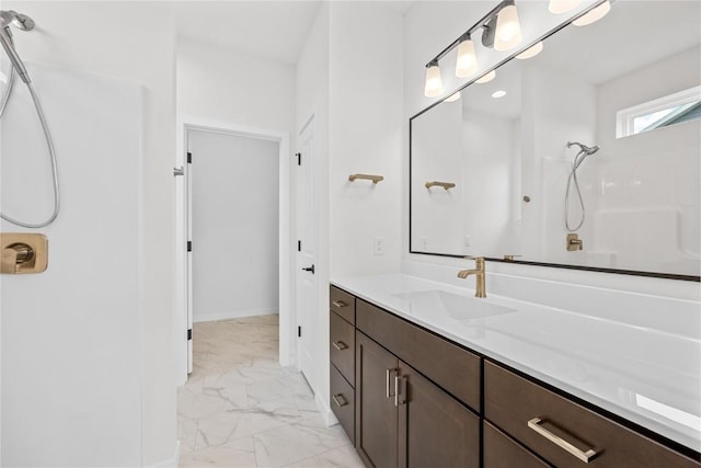 bathroom with vanity and a shower