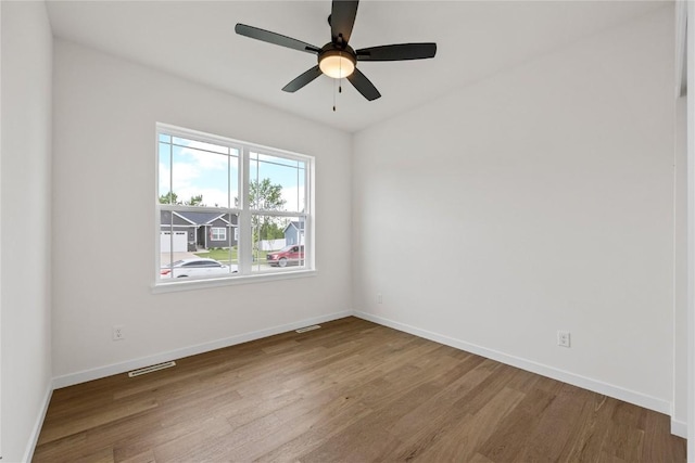 unfurnished room featuring hardwood / wood-style flooring and ceiling fan