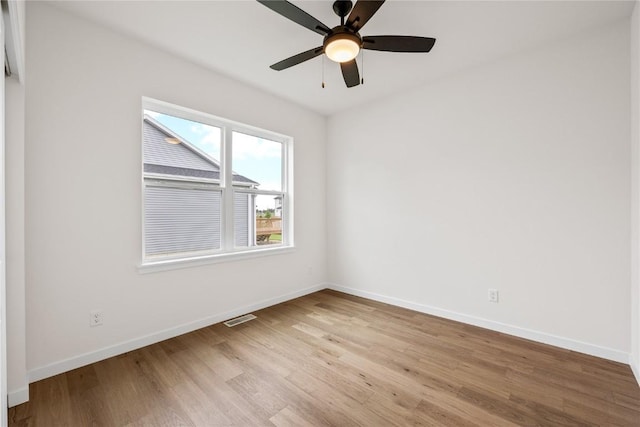 spare room featuring light hardwood / wood-style floors and ceiling fan