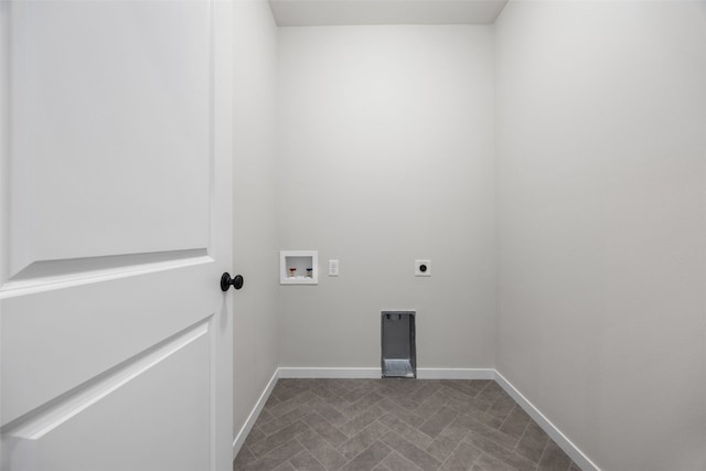 8908 Norway Dr NE, Cedar Rapids, IA 52402 - laundry room with hookup for an electric dryer, hookup for a washing machine, baseboards, and dark flooring