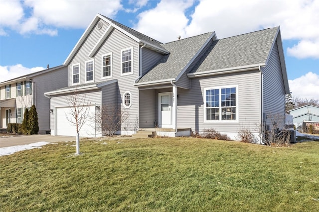 front of property featuring a garage and a front yard