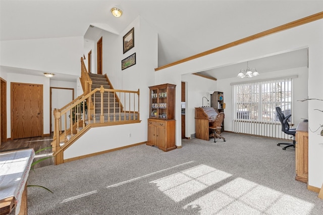 living room with an inviting chandelier, high vaulted ceiling, and carpet