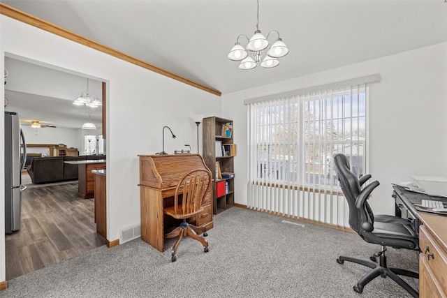 office featuring lofted ceiling, dark carpet, and a notable chandelier