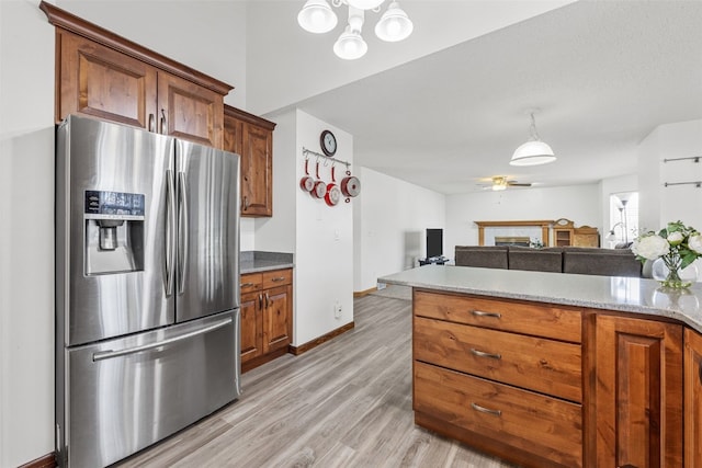 kitchen with stainless steel refrigerator with ice dispenser, ceiling fan, and light wood-type flooring