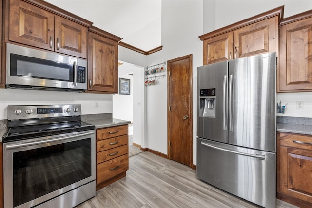 kitchen featuring light hardwood / wood-style flooring and appliances with stainless steel finishes