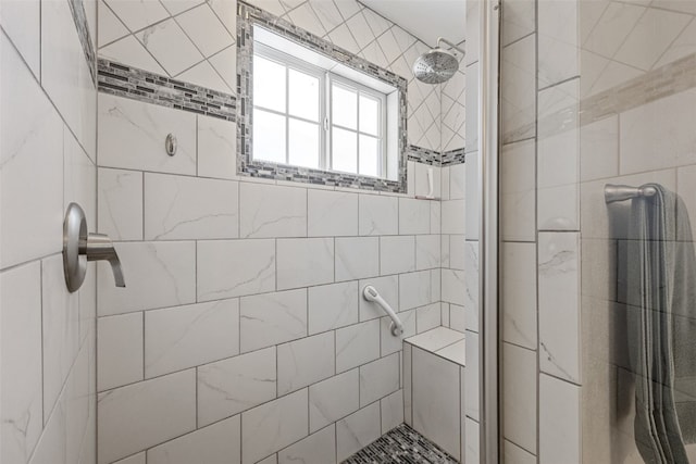 bathroom featuring a tile shower