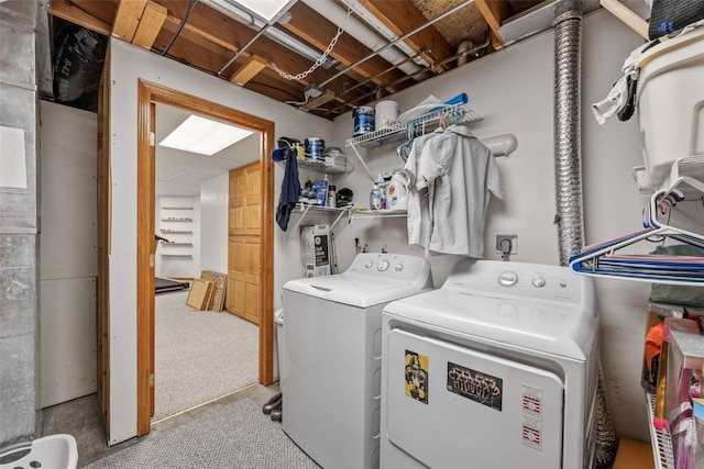 clothes washing area featuring independent washer and dryer