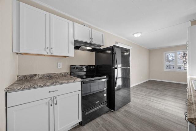 kitchen featuring white cabinetry, light hardwood / wood-style floors, and black appliances