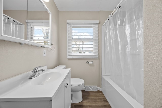 full bathroom with shower / bathtub combination with curtain, vanity, wood-type flooring, and toilet