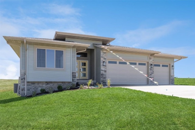 prairie-style house with a garage and a front yard