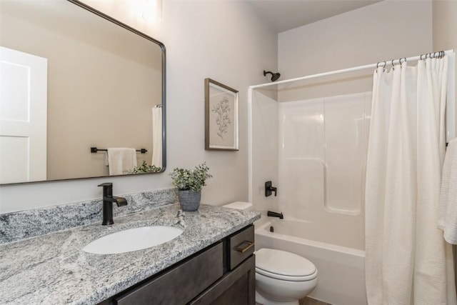 full bathroom featuring vanity, shower / tub combo with curtain, and toilet