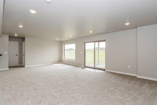 spare room with light colored carpet