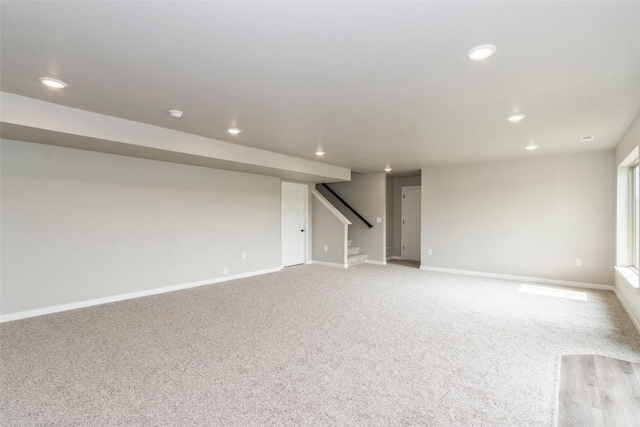 basement with light colored carpet