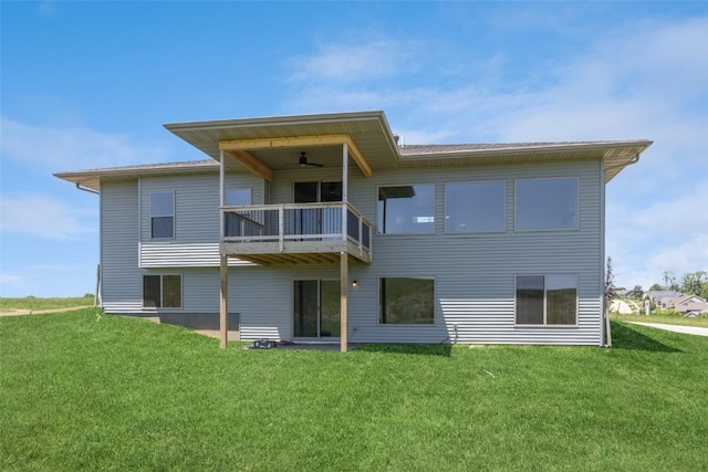 back of property with a balcony and a lawn