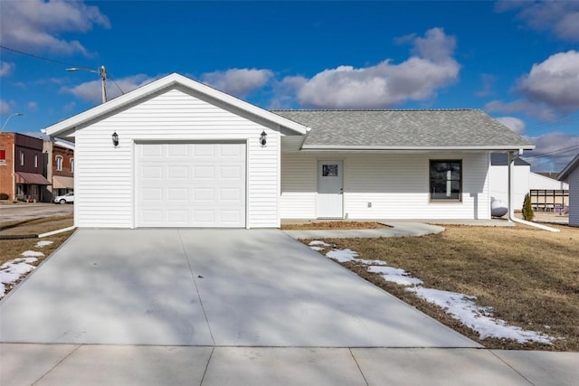 ranch-style house with a garage and a front lawn