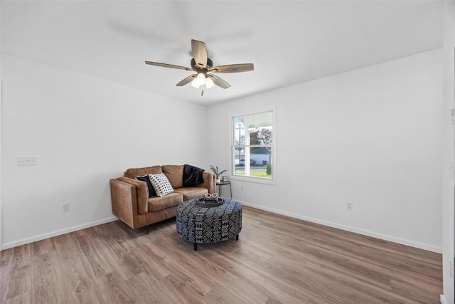 sitting room featuring hardwood / wood-style flooring and ceiling fan