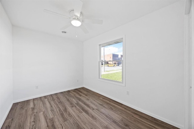 empty room featuring wood-type flooring and ceiling fan