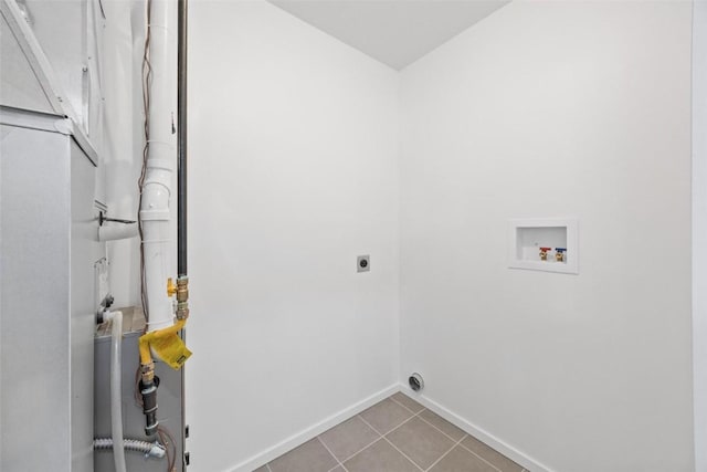 laundry room with washer hookup, light tile patterned floors, and electric dryer hookup