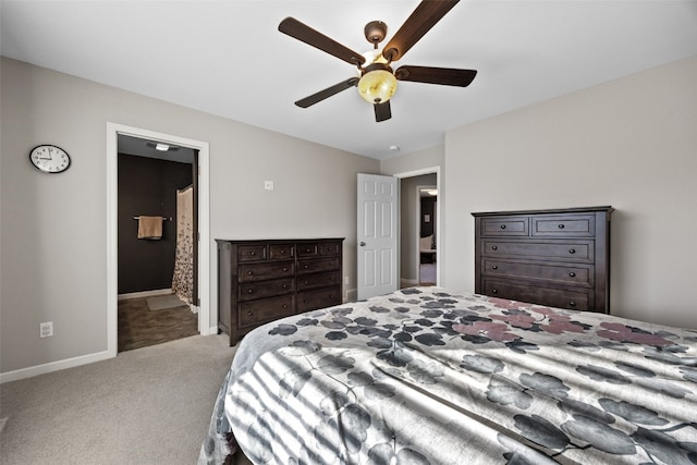 carpeted bedroom with ceiling fan and ensuite bathroom