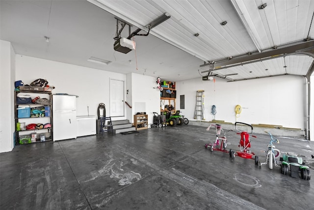 garage featuring a garage door opener, electric panel, and white fridge