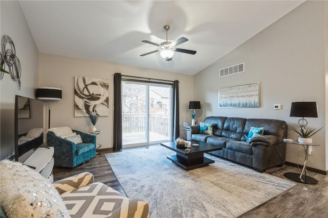 living room with hardwood / wood-style floors, vaulted ceiling, and ceiling fan