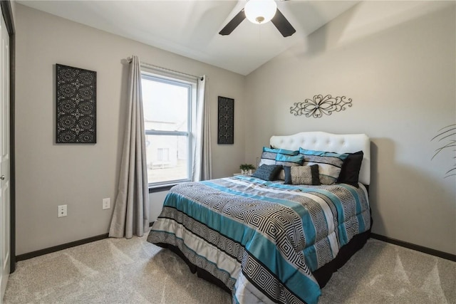 carpeted bedroom featuring vaulted ceiling and ceiling fan