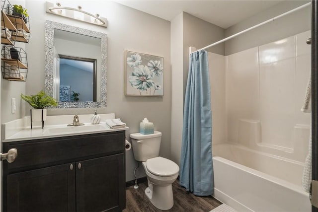 full bathroom with shower / bathtub combination with curtain, hardwood / wood-style floors, vanity, and toilet