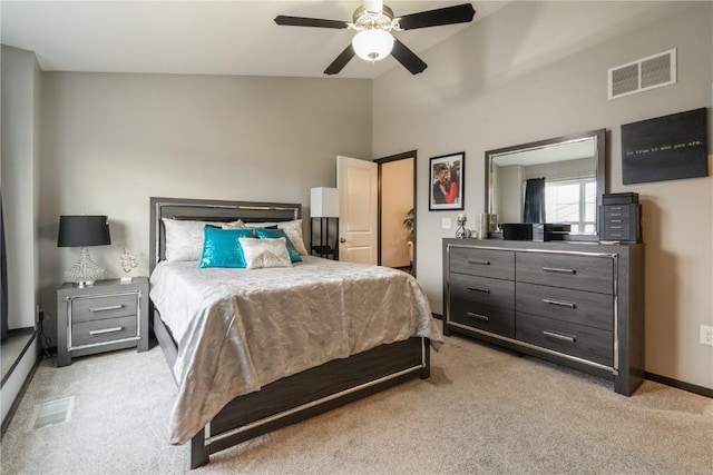 bedroom featuring lofted ceiling, light colored carpet, and ceiling fan