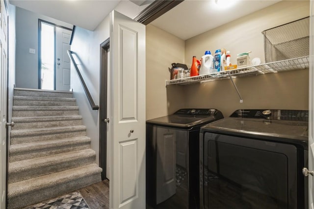 washroom featuring wood-type flooring and separate washer and dryer