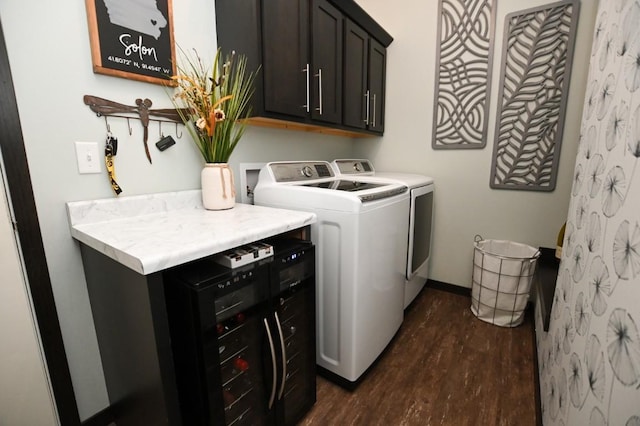 laundry room with cabinets, separate washer and dryer, beverage cooler, and dark hardwood / wood-style flooring