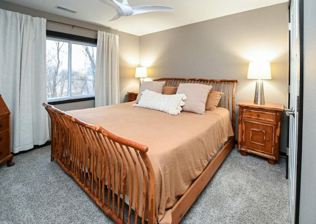 carpeted bedroom with ceiling fan